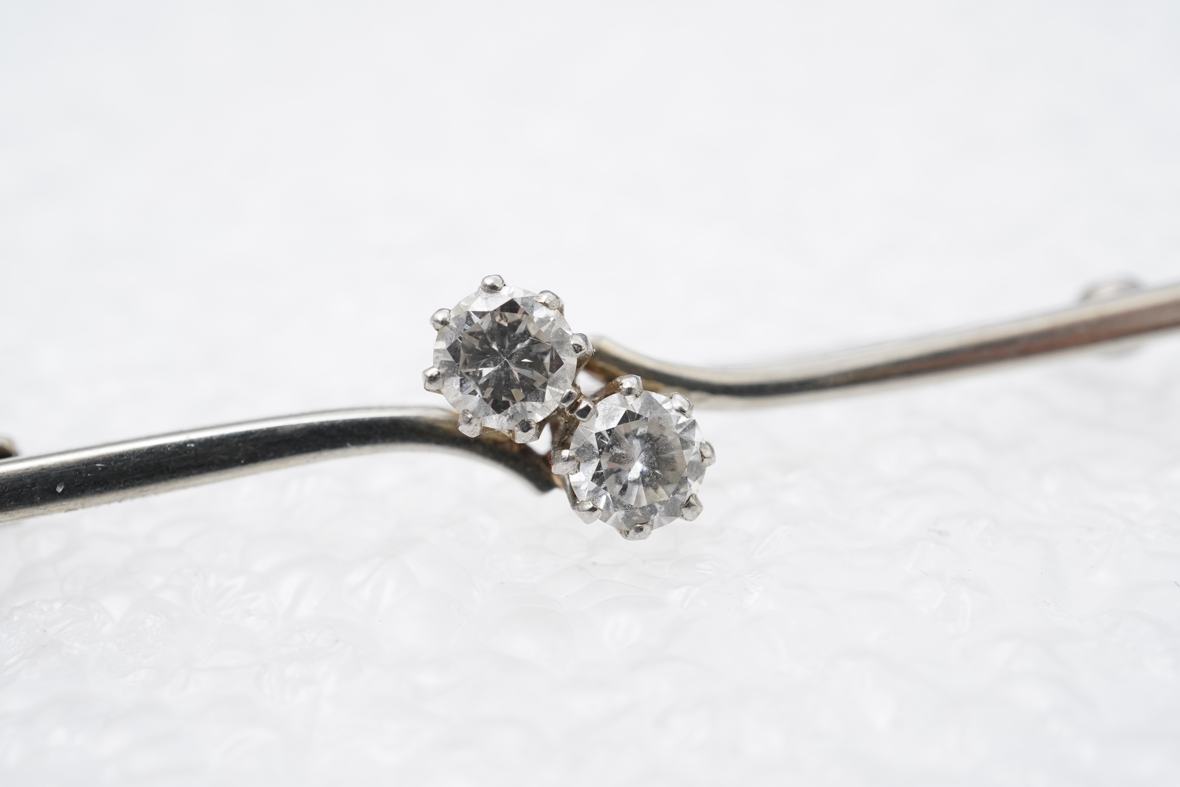 A diamond bar brooch